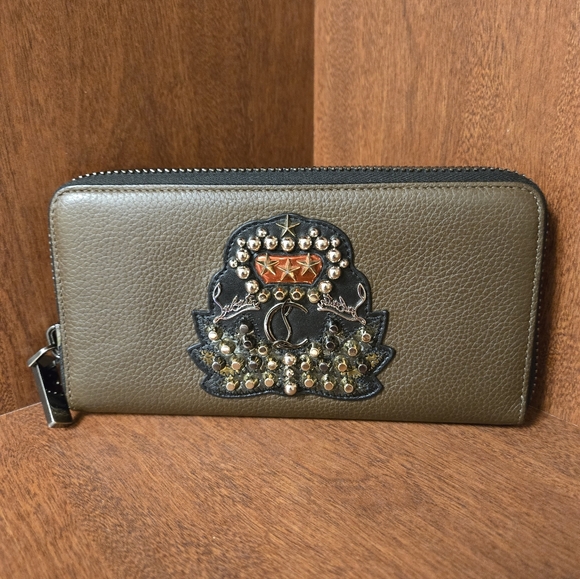 Christian Louboutin Handbags - Authentic Christian Louboutin leather studded zippy wallet in great condition
